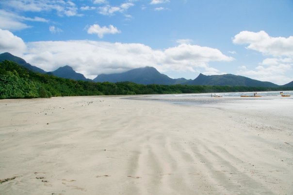 A scenery is always prepossessing with the sands on the shore and hills at the front along with kayaks at Hinchinbrook Island